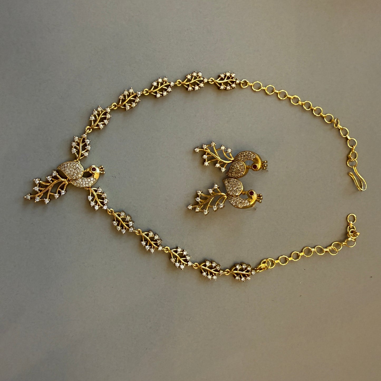 Gracie Gold plated peacock necklace with matching earrings