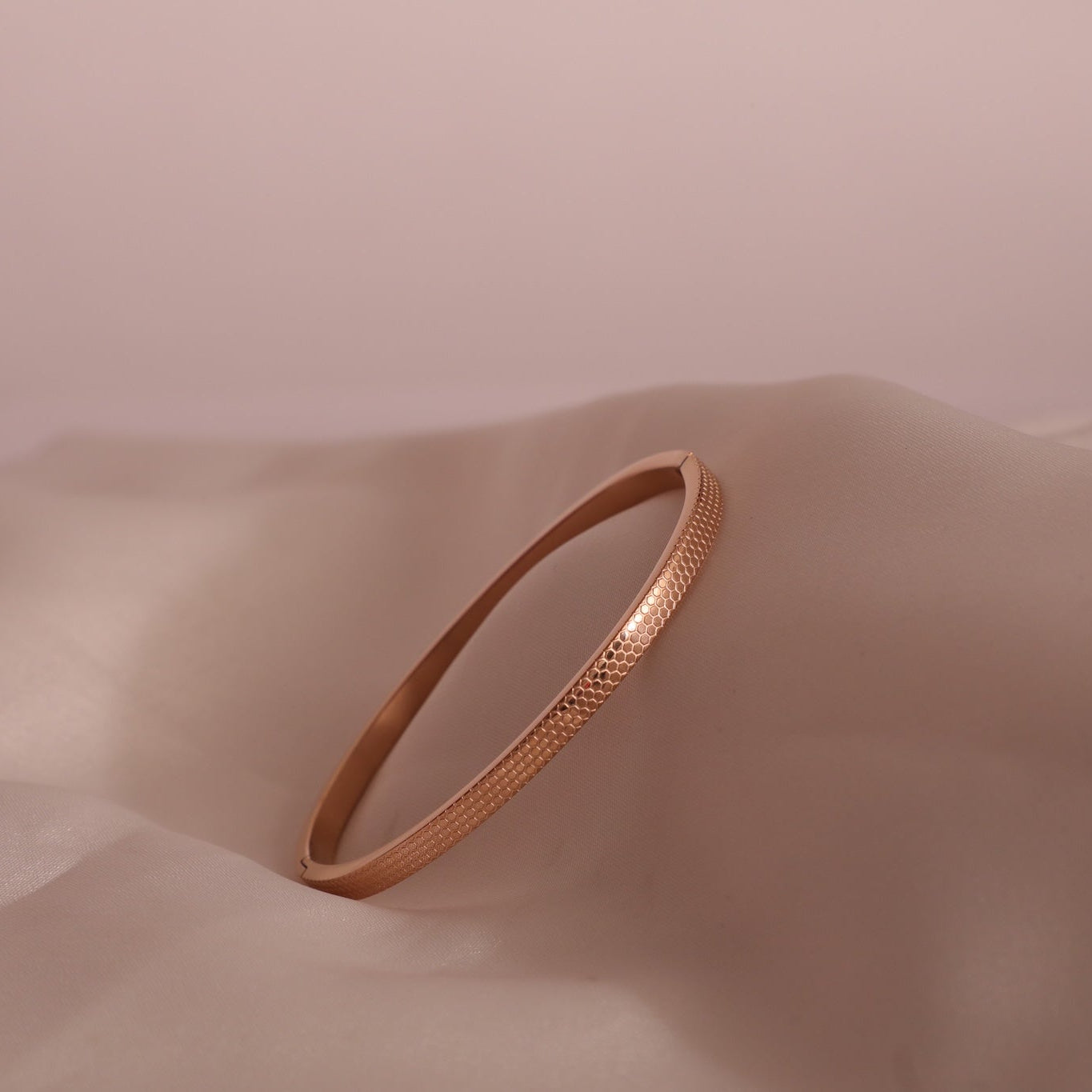 Lena Rose gold tone bangle in honeycomb design